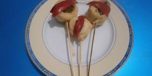 Piruletas de filete de panga con relleno de alcachofa